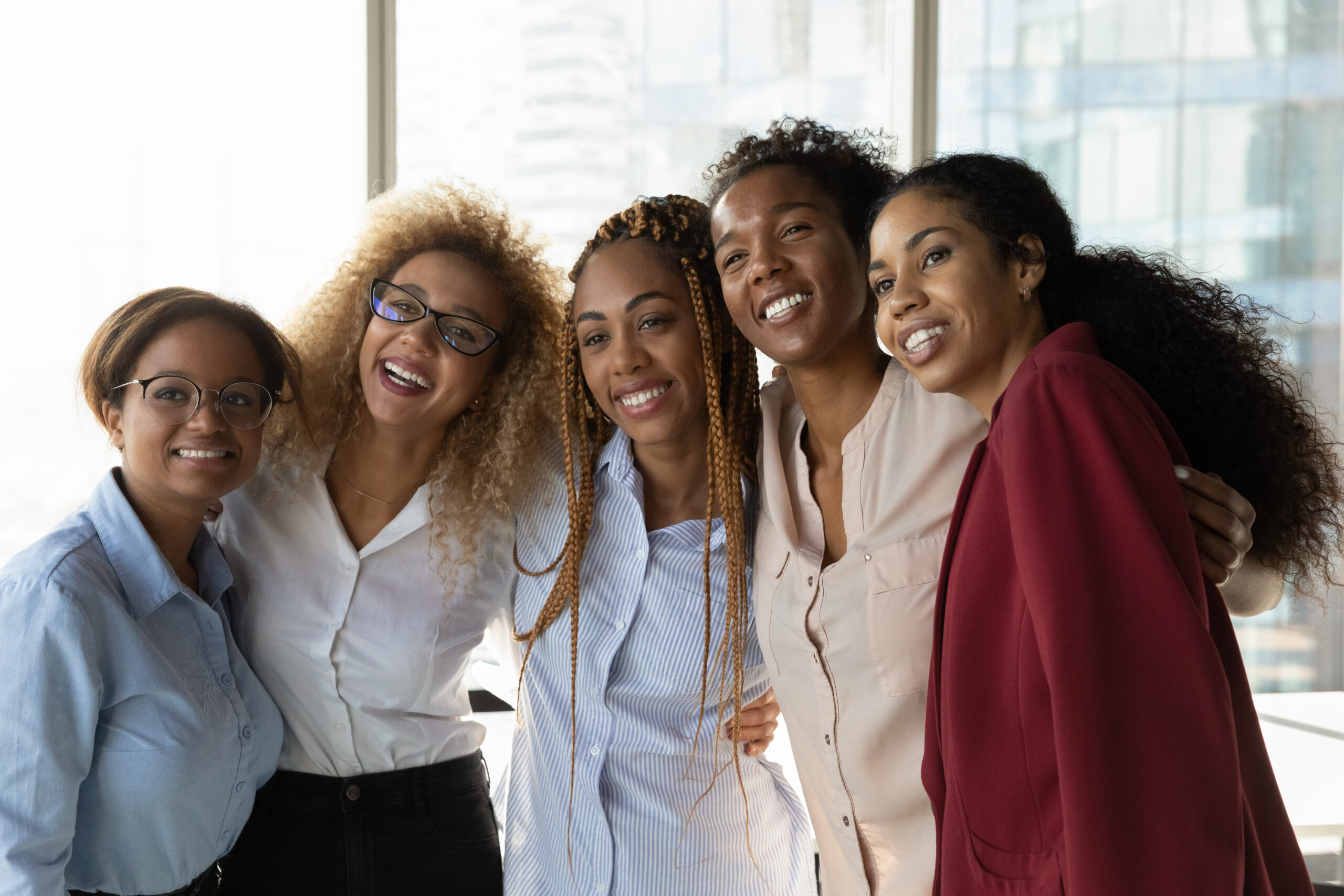 Overjoyed,Multiethnic,Diverse,Female,Colleagues,Hug,Pose,For,Team,Self-portrait
